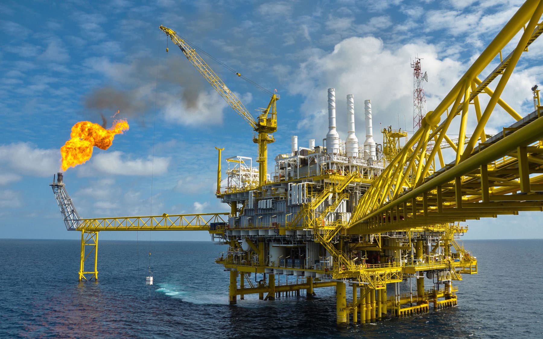 An offshore oil and gas platform operating in the ocean.